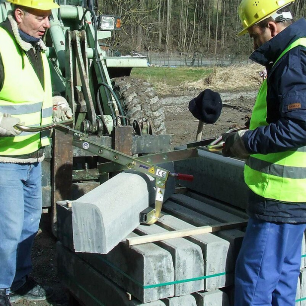 Probst Universal Handle BVZ on construction site Probst BVZ handle in use Probst BVZ lifting kerbs and blocks Probst BVZ in application on pavement