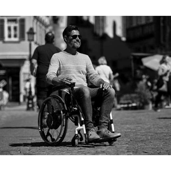 AAT SOLO+ | Add-on electric power assist system for manual wheelchairs with lithium battery | 250 kg AAT SOLO+ | Add-on electric power assist system for manual wheelchairs with lithium battery | 250 kg - Kapountalis