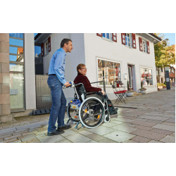 AAT V‑MAX | Add-on electric power assist system for wheelchairs | Standard 179 kg & Plus 300 kg AAT V‑MAX | Add-on electric power assist system for wheelchairs | Standard 179 kg & Plus 300 kg
